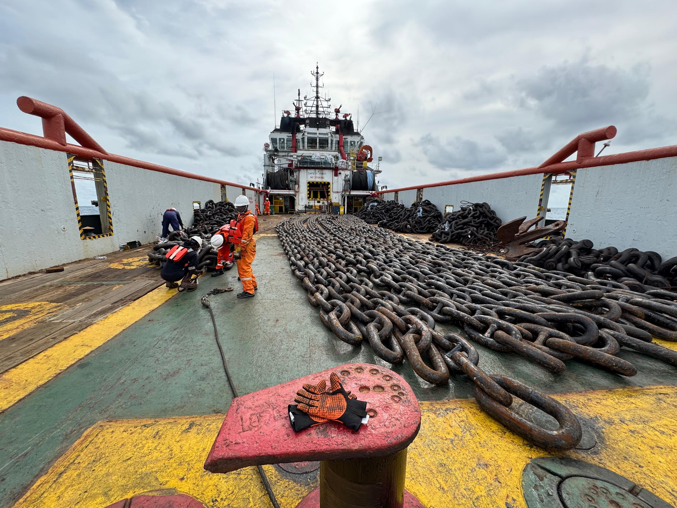 Heavy mooring chains arranged across an offshore vessel deck
