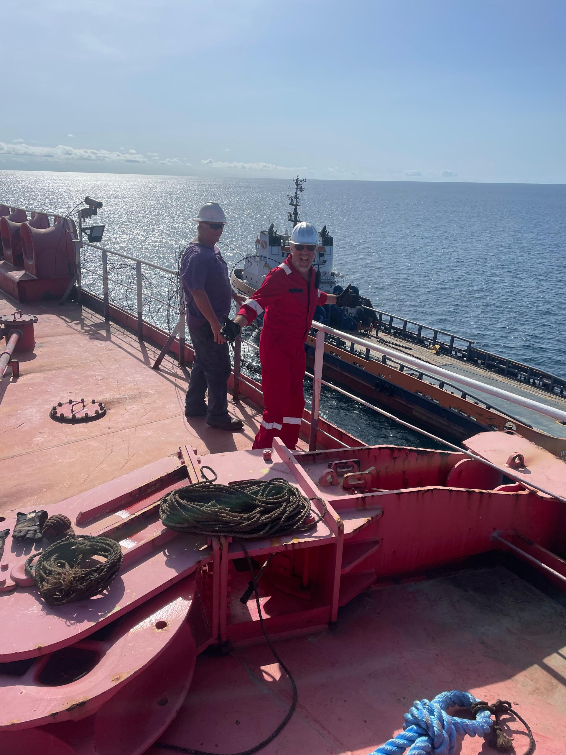 Marine project leaders overseeing a support vessel offshore